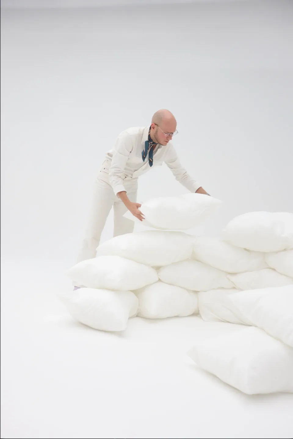 Dmitrii Kitavin arranging a sculptural white set